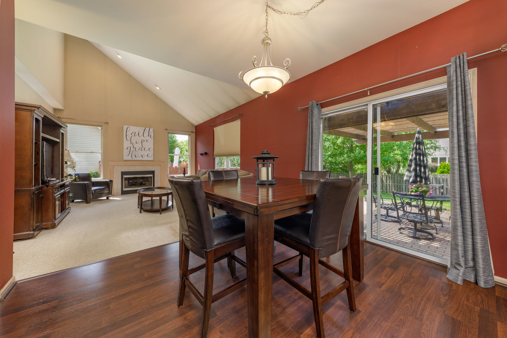 11654 Olympic Drive Plainfield, IL 60585 - Photo 7 of 25 a view of a dining room with furniture window and wooden floor