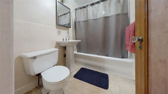 a bathroom with a toilet and a sink