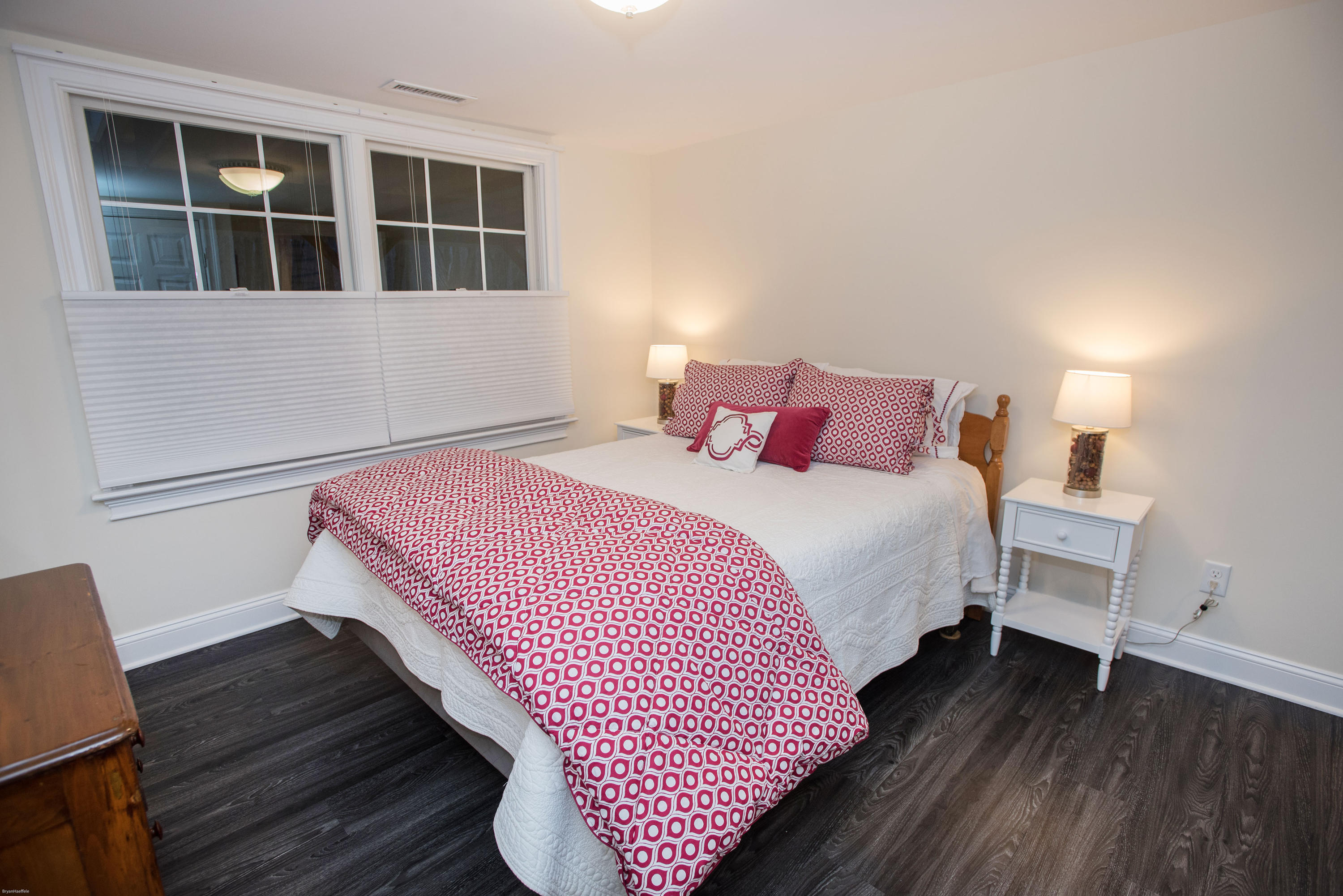 301 Quarry Road Stamford, CT 06903 - Photo 21 of 32 a bedroom with a bed and wooden floor