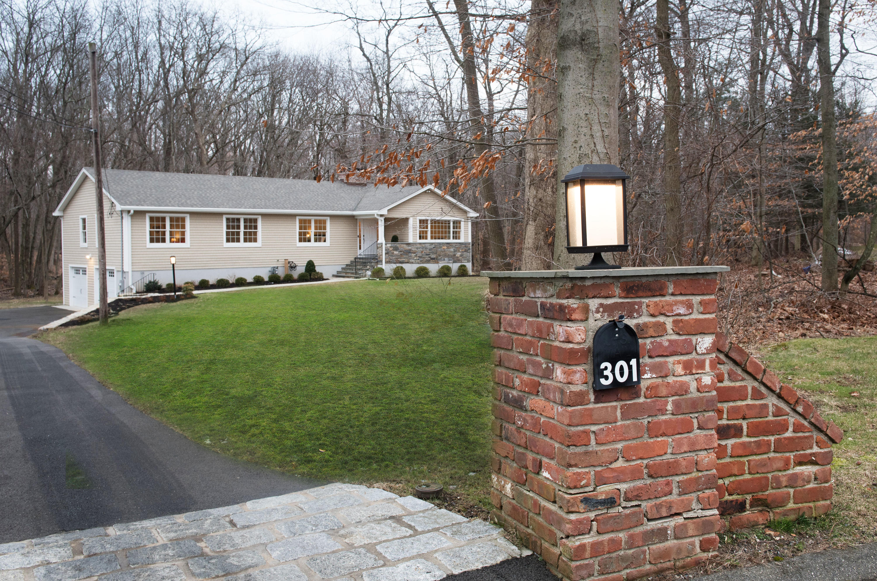301 Quarry Road Stamford, CT 06903 - Photo 30 of 32 a front view of a house with a garden