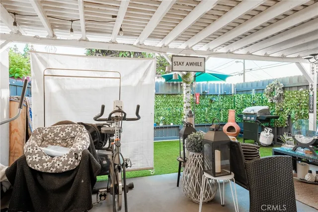 a view of a chairs and tables in patio