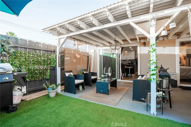 a view of a porch with chairs and backyard