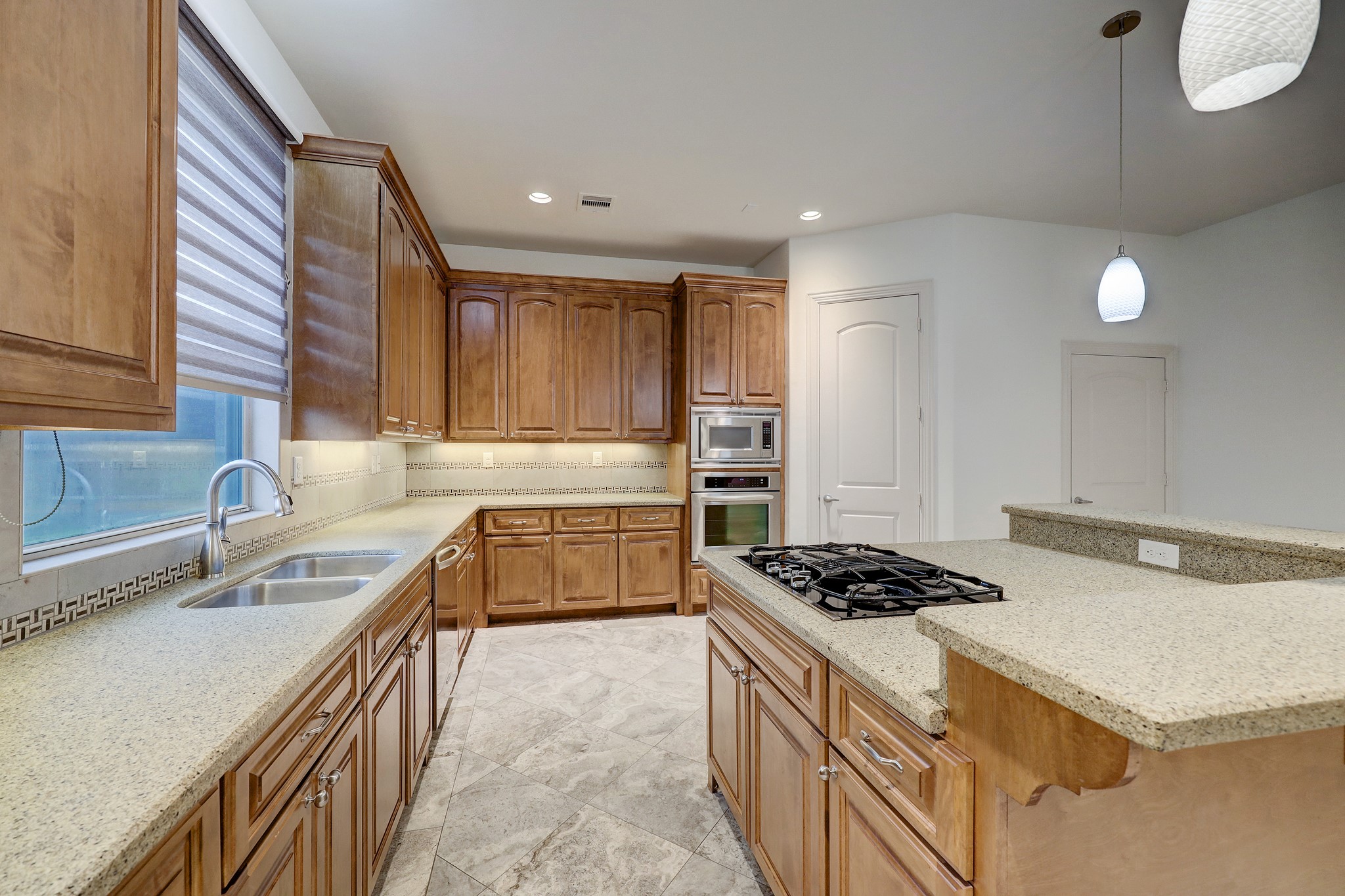 1805 Arbor Street Houston, TX 77004 - Photo 13 of 25 a kitchen that has a sink and a stove