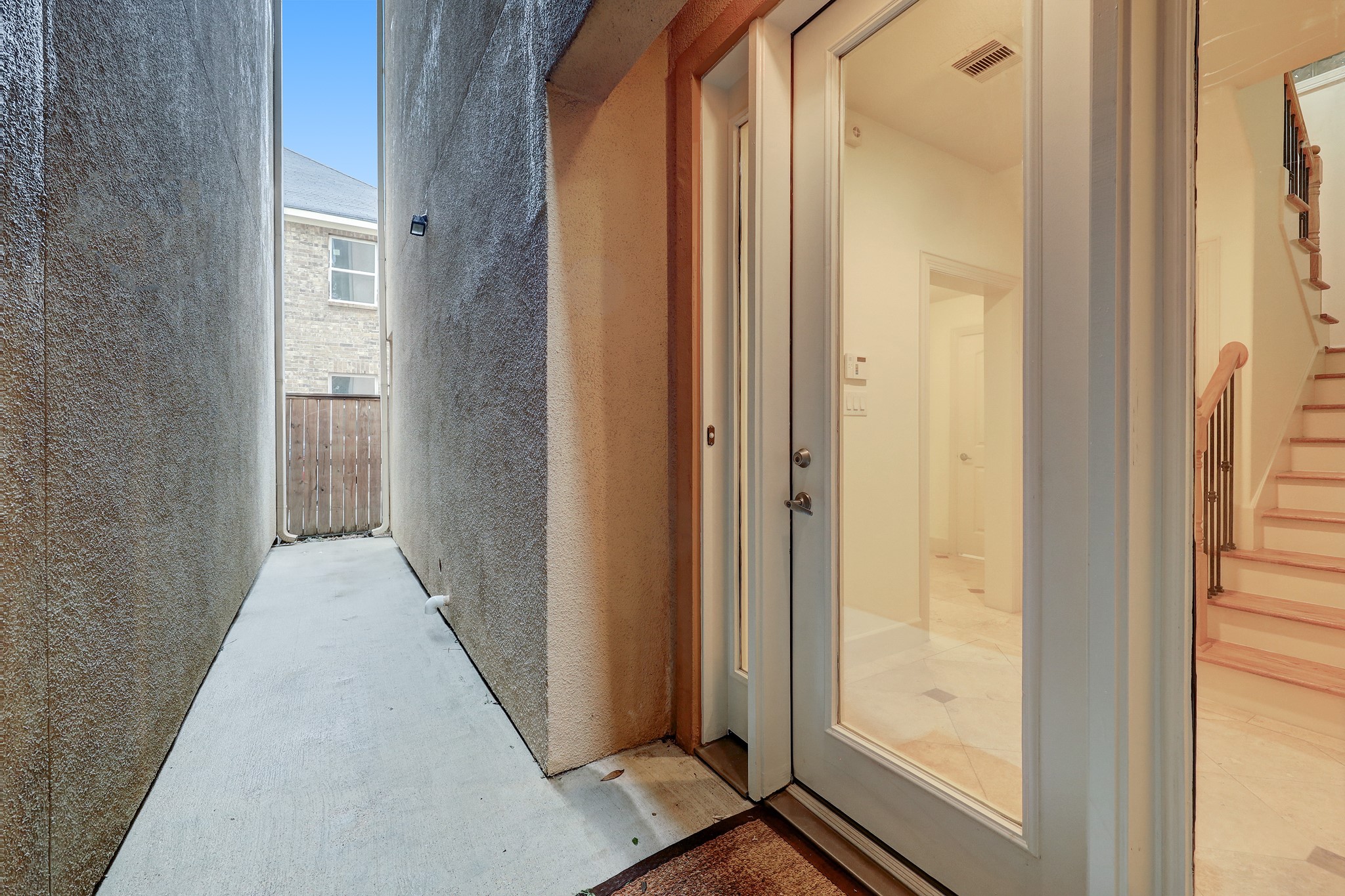 1805 Arbor Street Houston, TX 77004 - Photo 4 of 25 a view of a hallway with wooden floor and a bathroom