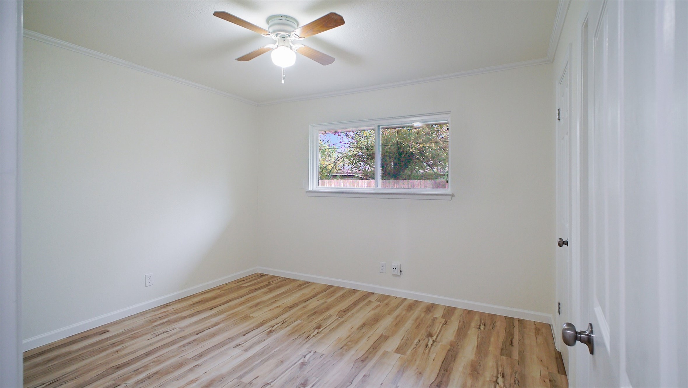 3513 Tanglebriar Drive Pasadena, TX 77503 - Photo 16 of 21 wooden floor in an empty room with a window