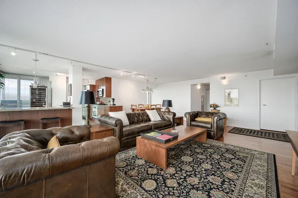 a living room with furniture and a rug