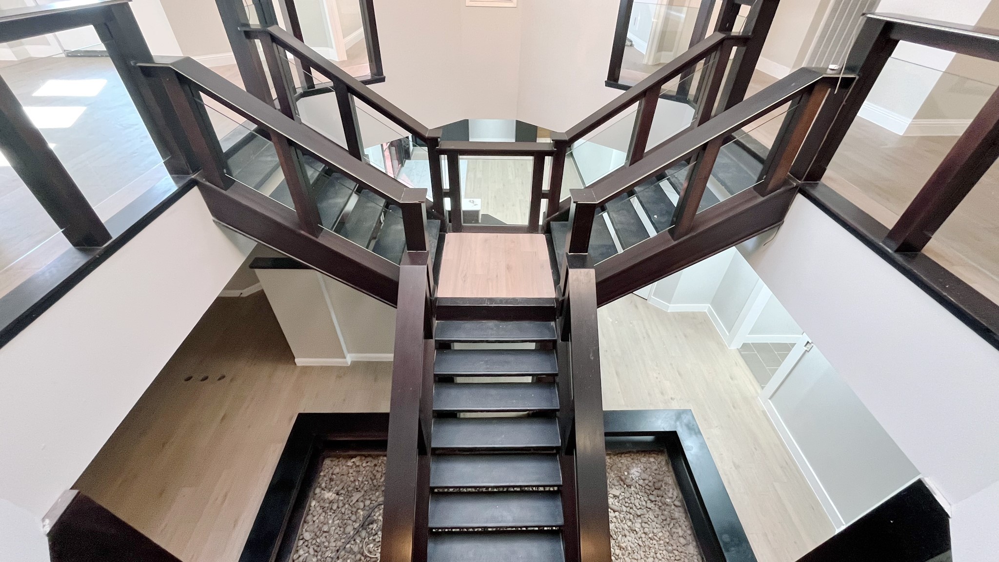 9220 Rasmus Drive Houston, TX 77063 - Photo 15 of 20 a view of staircase with lots of frames on wall and a window