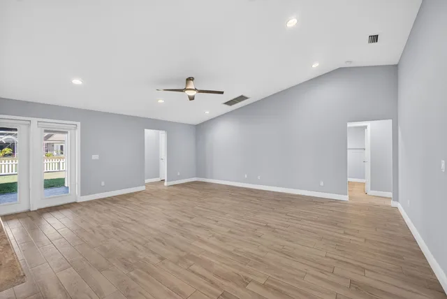 a front view of a house with a big yard