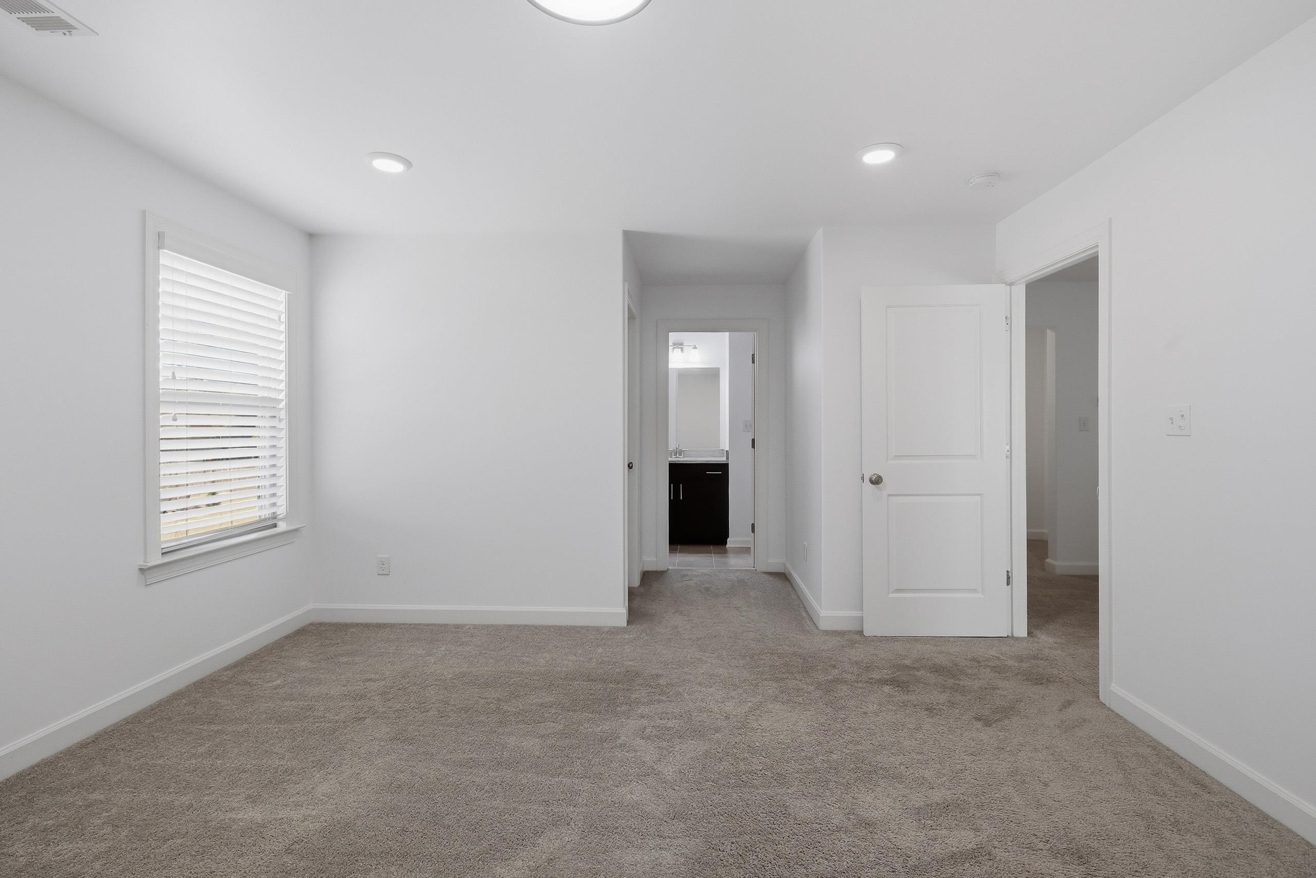 496 Fallen Timbers Cove Collierville, TN 38017 - Photo 31 of 40 Unfurnished room with light colored carpet and recessed lighting