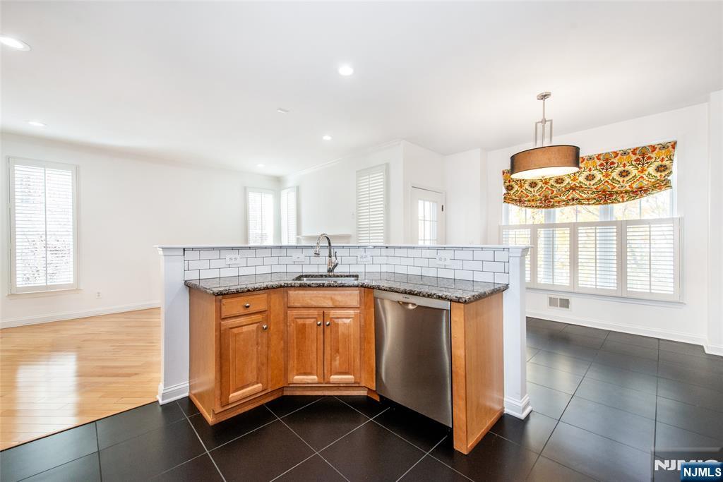 43 South Shore Drive, Unit 81 South Amboy, NJ 08879 - Photo 15 of 30 a kitchen with granite countertop a stove and a sink
