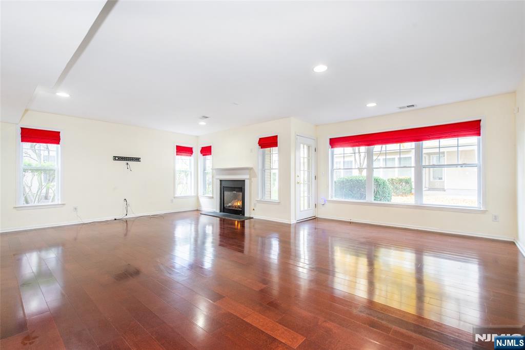 43 South Shore Drive, Unit 81 South Amboy, NJ 08879 - Photo 26 of 30 an empty room with wooden floor and windows