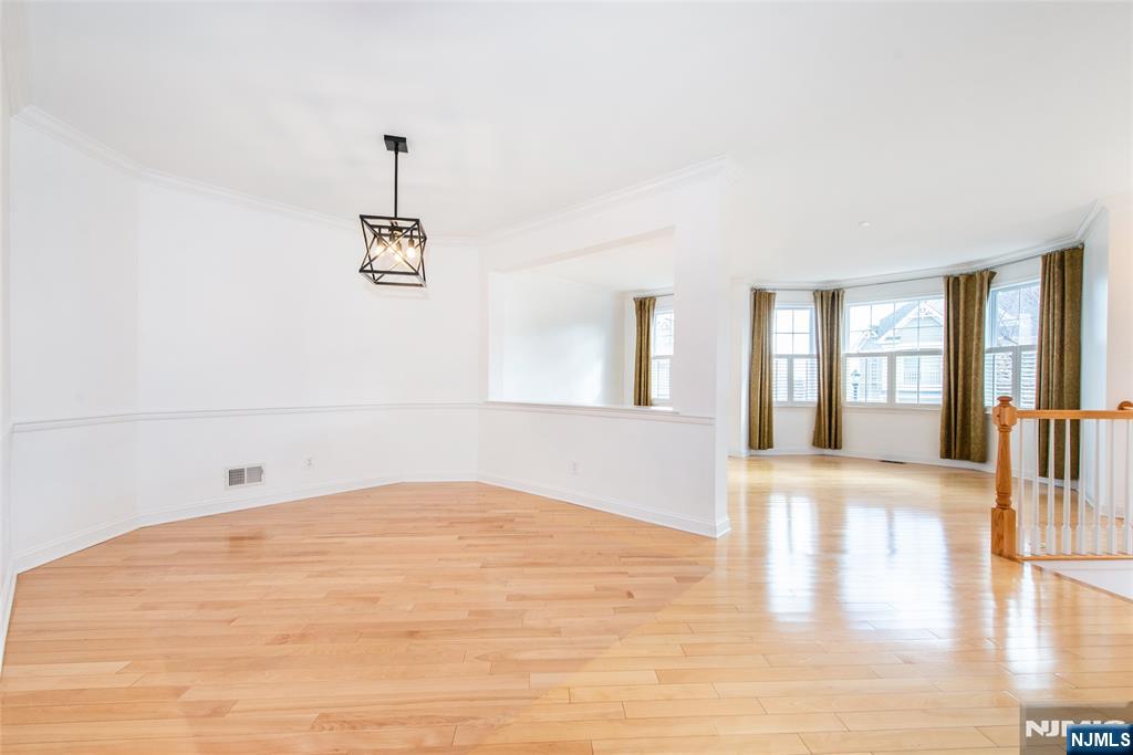 43 South Shore Drive, Unit 81 South Amboy, NJ 08879 - Photo 8 of 30 a view of empty room with wooden floor and fan