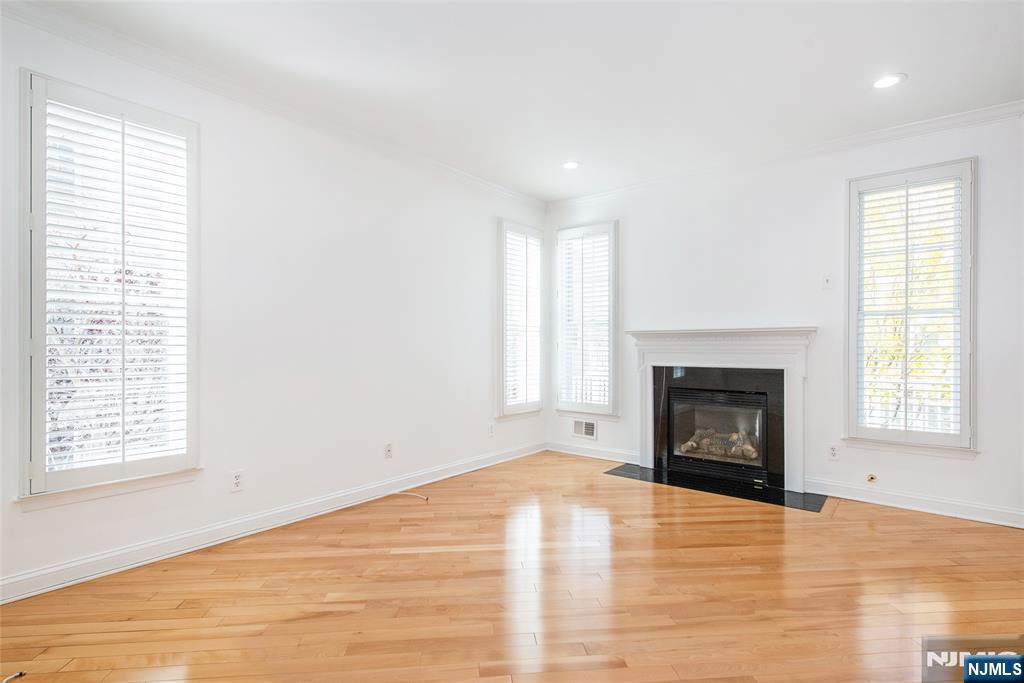 43 South Shore Drive, Unit 81 South Amboy, NJ 08879 - Photo 10 of 30 an empty room with windows and a fireplace