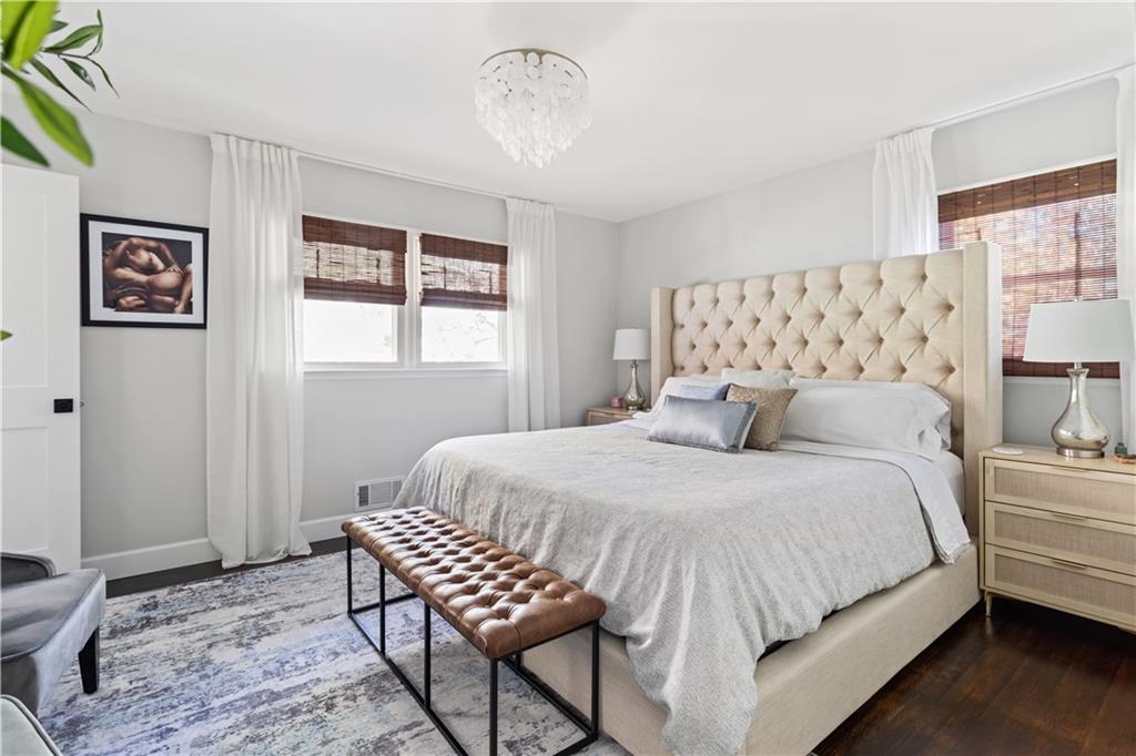 5925 Old Bill Cook Road Atlanta, GA 30349 - Photo 11 of 49 a bedroom with a bed and wooden floor