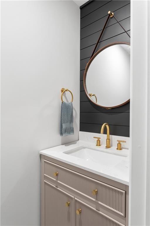 5925 Old Bill Cook Road Atlanta, GA 30349 - Photo 20 of 49 a bathroom with a sink and a mirror