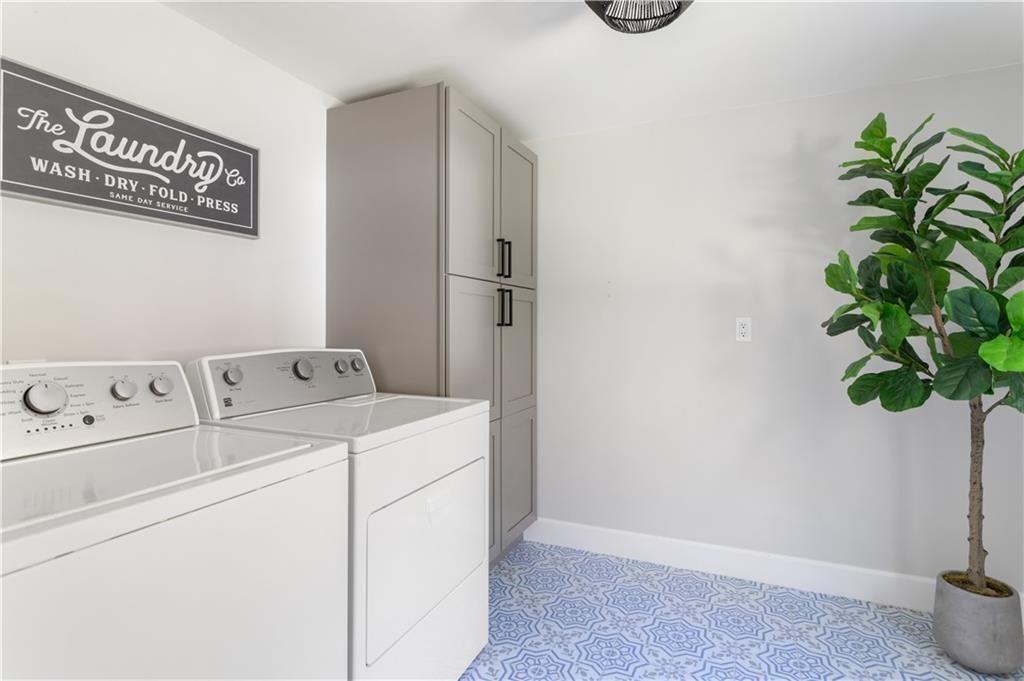 5925 Old Bill Cook Road Atlanta, GA 30349 - Photo 21 of 49 a utility room with dryer and washer