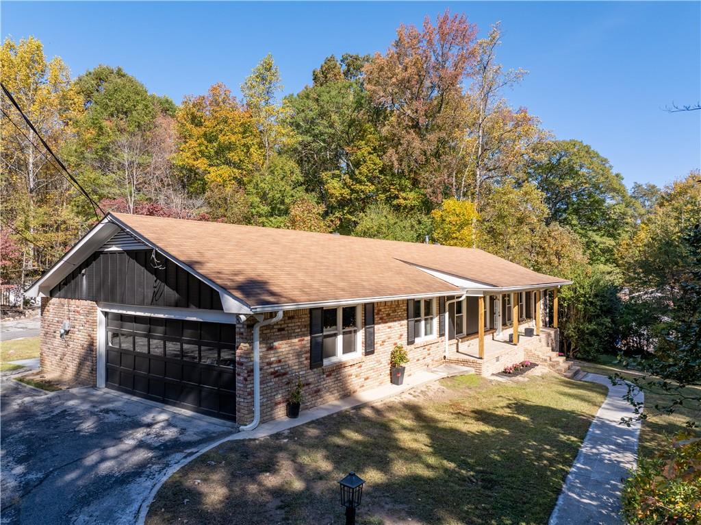 5925 Old Bill Cook Road Atlanta, GA 30349 - Photo 31 of 49 a view of house with outdoor space and sitting area