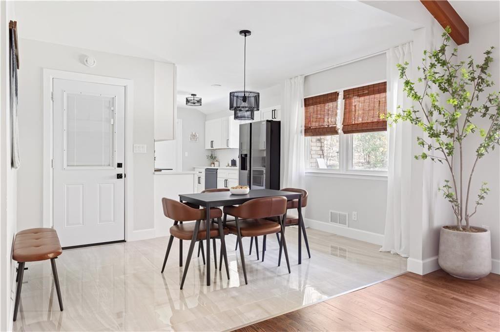 5925 Old Bill Cook Road Atlanta, GA 30349 - Photo 6 of 49 a view of a dining room with furniture window and wooden floor
