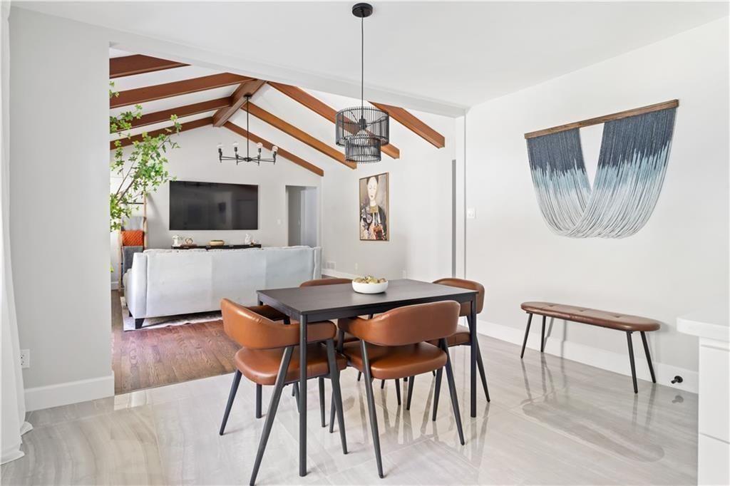 5925 Old Bill Cook Road Atlanta, GA 30349 - Photo 7 of 49 a view of a dining room with furniture and wooden floor