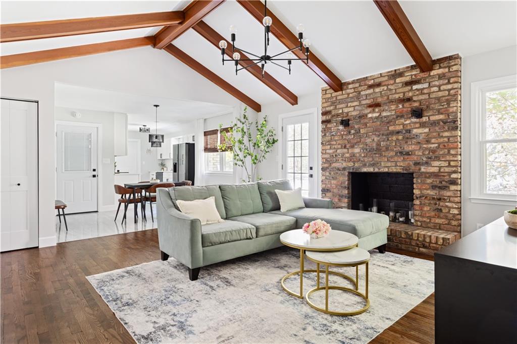 5925 Old Bill Cook Road Atlanta, GA 30349 - Photo 8 of 49 a living room with furniture a fireplace and a table