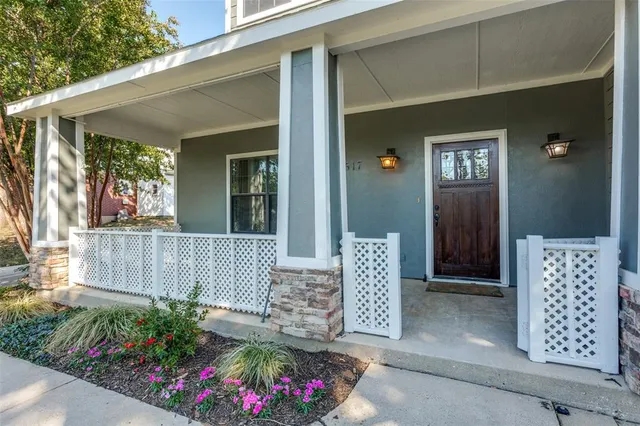 a view of a front door and wooden floor