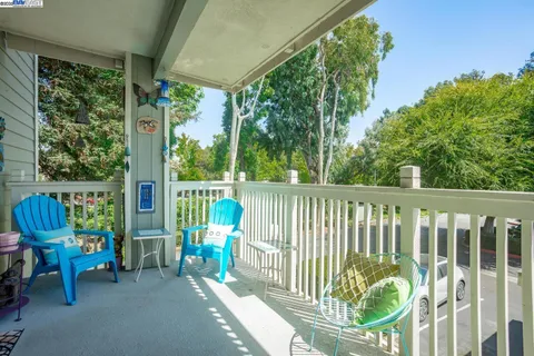 a view of a chair and tables in the porch