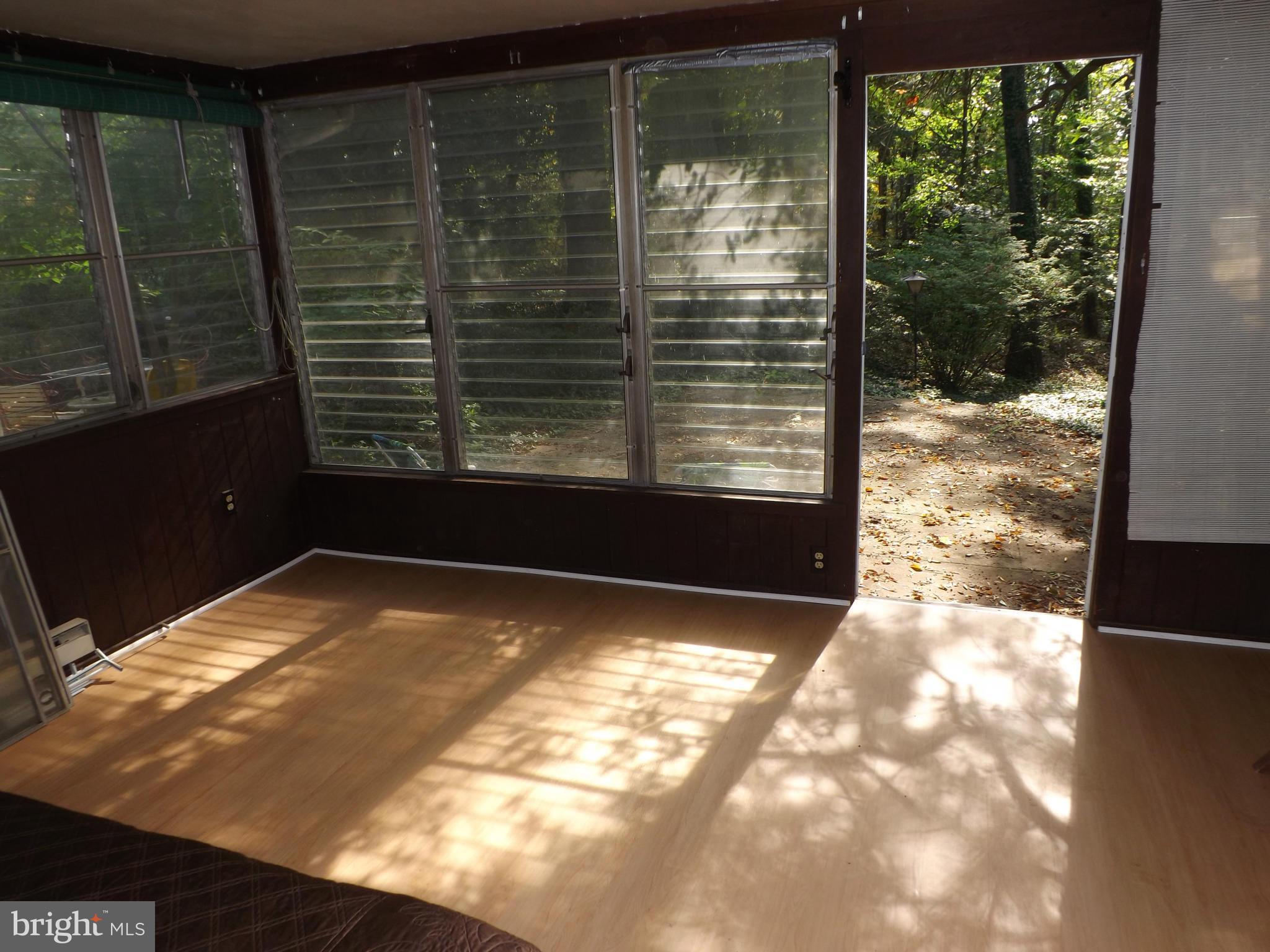 6 Ridge Road, Unit Q Greenbelt, MD 20770 - Photo 13 of 30 New Flooring in Addition - Back Porch Enclosure