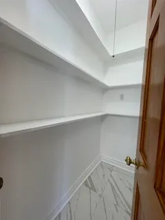 a kitchen with granite countertop a stove a sink and a microwave