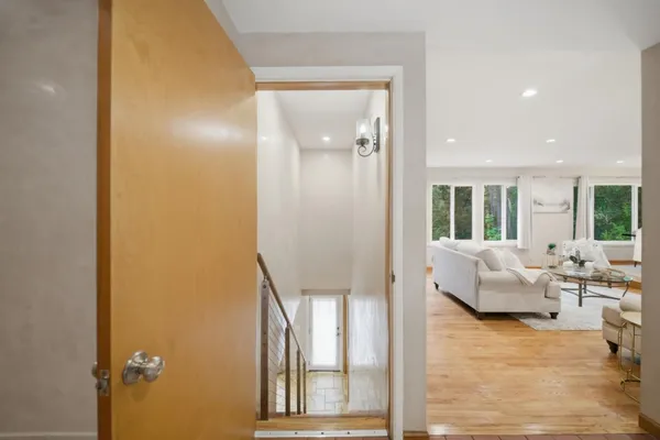 a living room with furniture and a floor to ceiling window