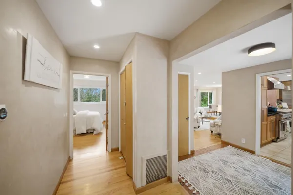a spacious bathroom with a double vanity sink a mirror and a bathtub