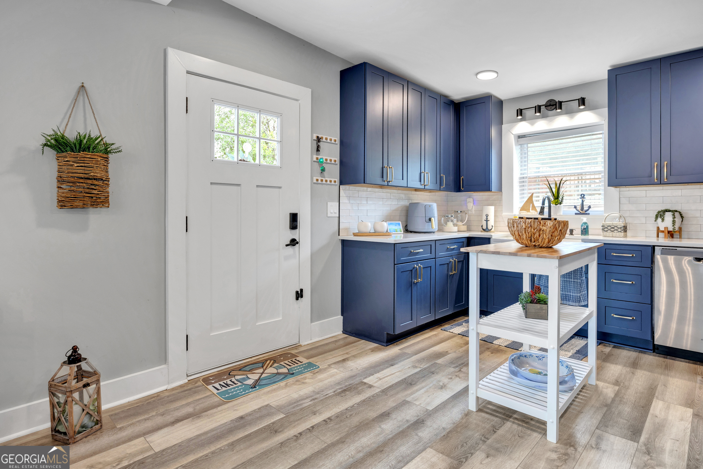 8900 Jackson Lake Road Monticello, GA 31064 - Photo 21 of 72 a kitchen with a sink cabinets and window