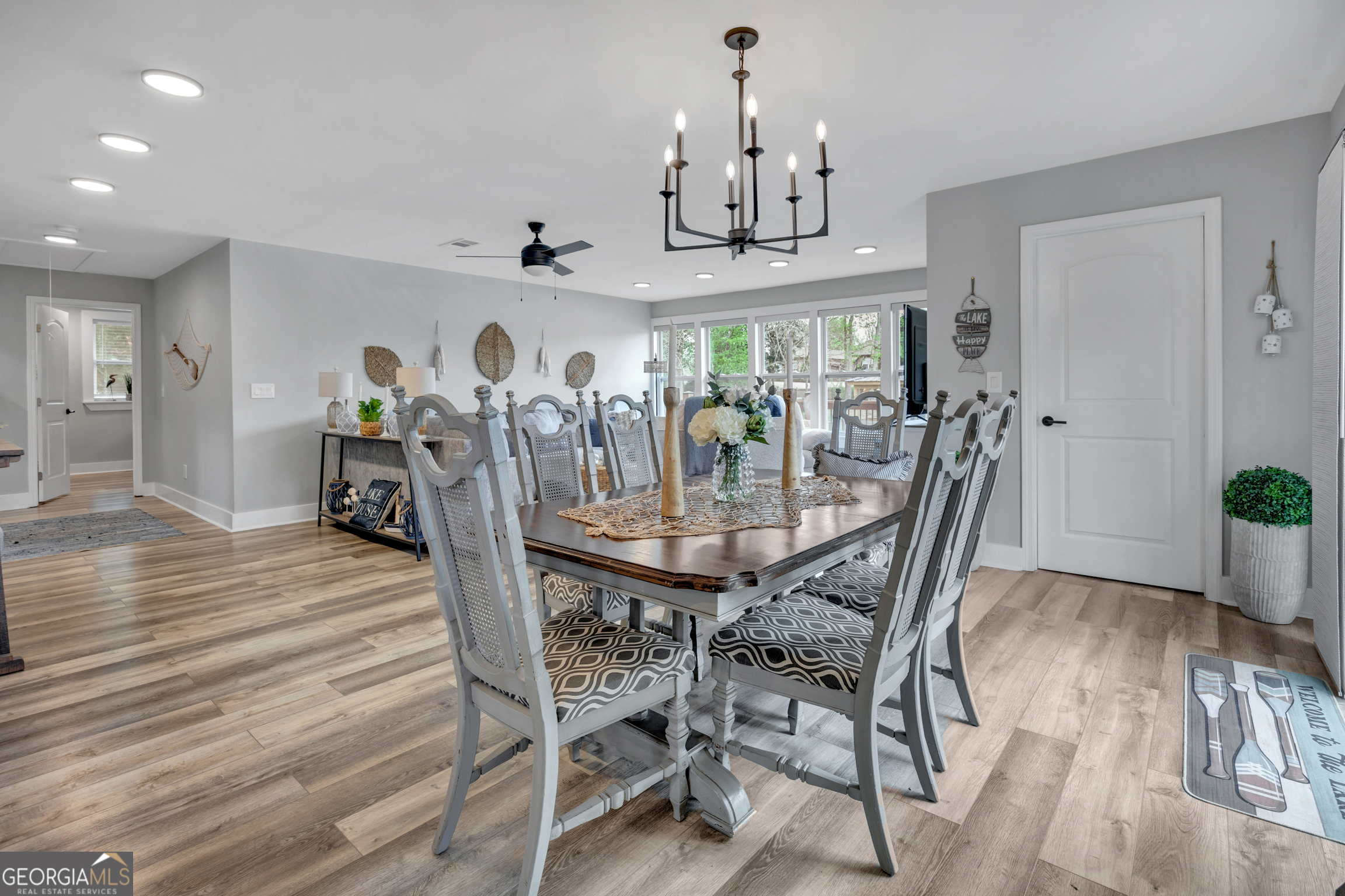 8900 Jackson Lake Road Monticello, GA 31064 - Photo 23 of 72 a view of a dining room with furniture and wooden floor