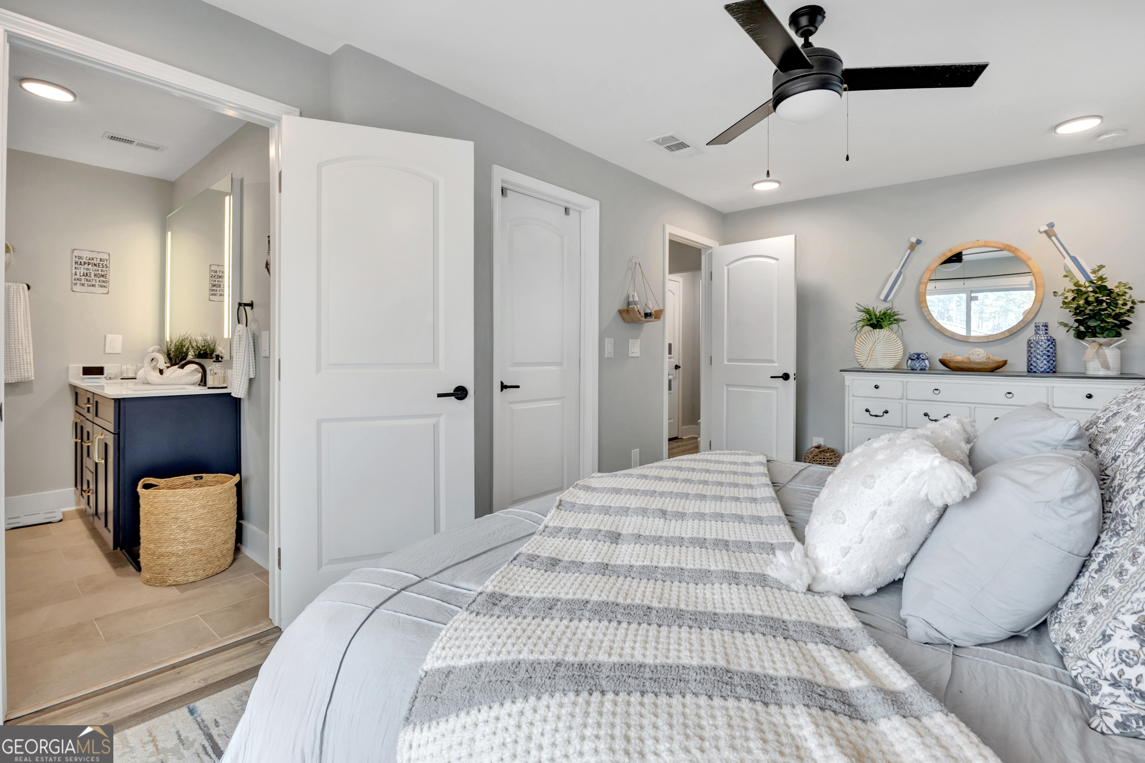 8900 Jackson Lake Road Monticello, GA 31064 - Photo 38 of 72 a bedroom with a bed and a mirror