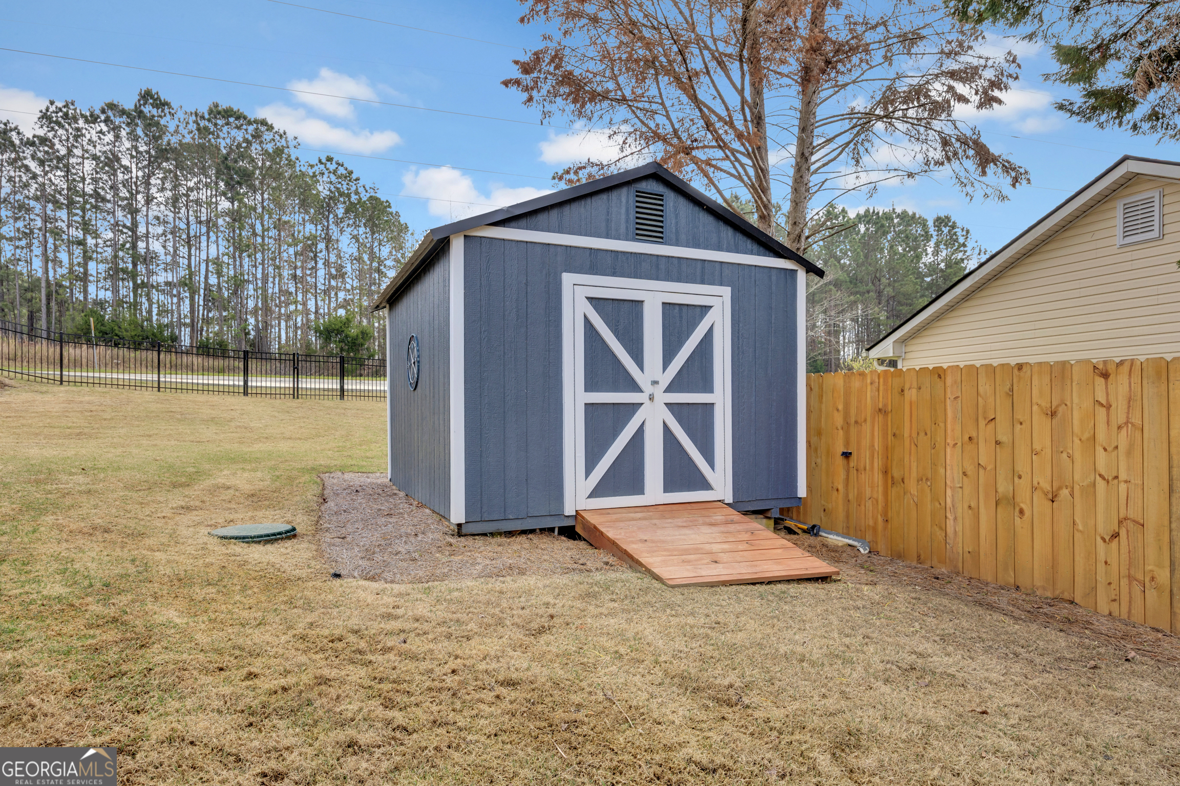 8900 Jackson Lake Road Monticello, GA 31064 - Photo 54 of 72 a view of backyard with wooden fence