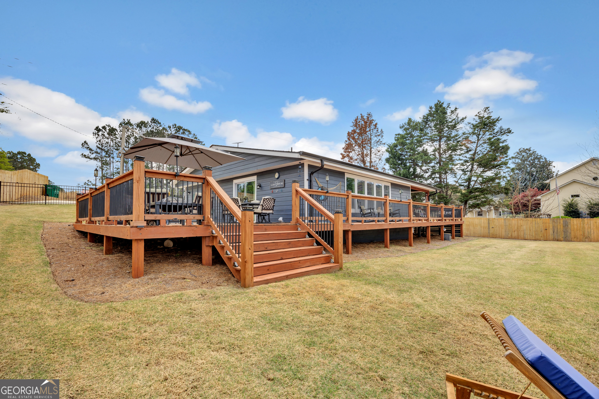 8900 Jackson Lake Road Monticello, GA 31064 - Photo 56 of 72 a view of a house with a yard balcony and slide