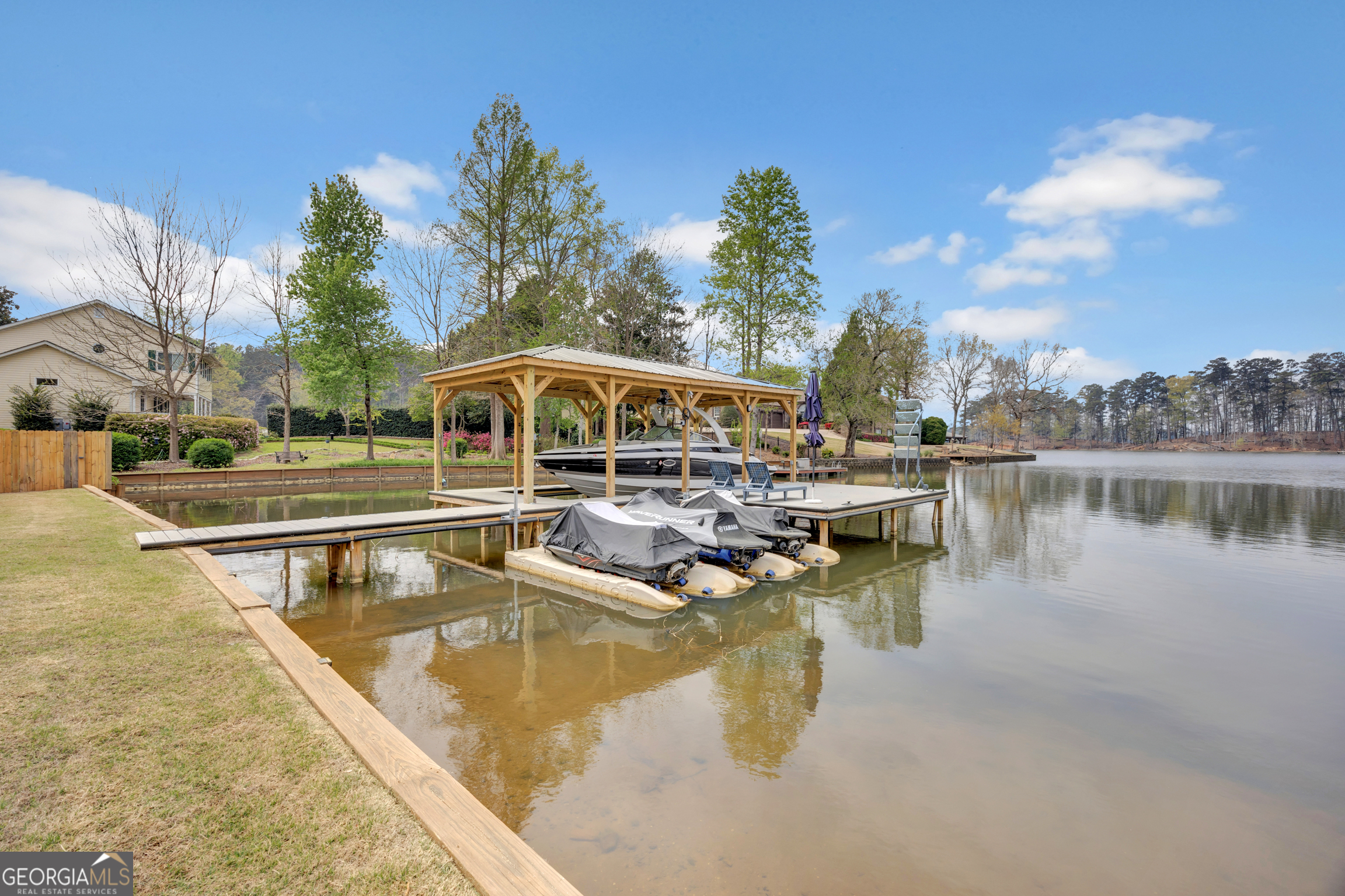 8900 Jackson Lake Road Monticello, GA 31064 - Photo 57 of 72 a view of a swimming pool with a patio