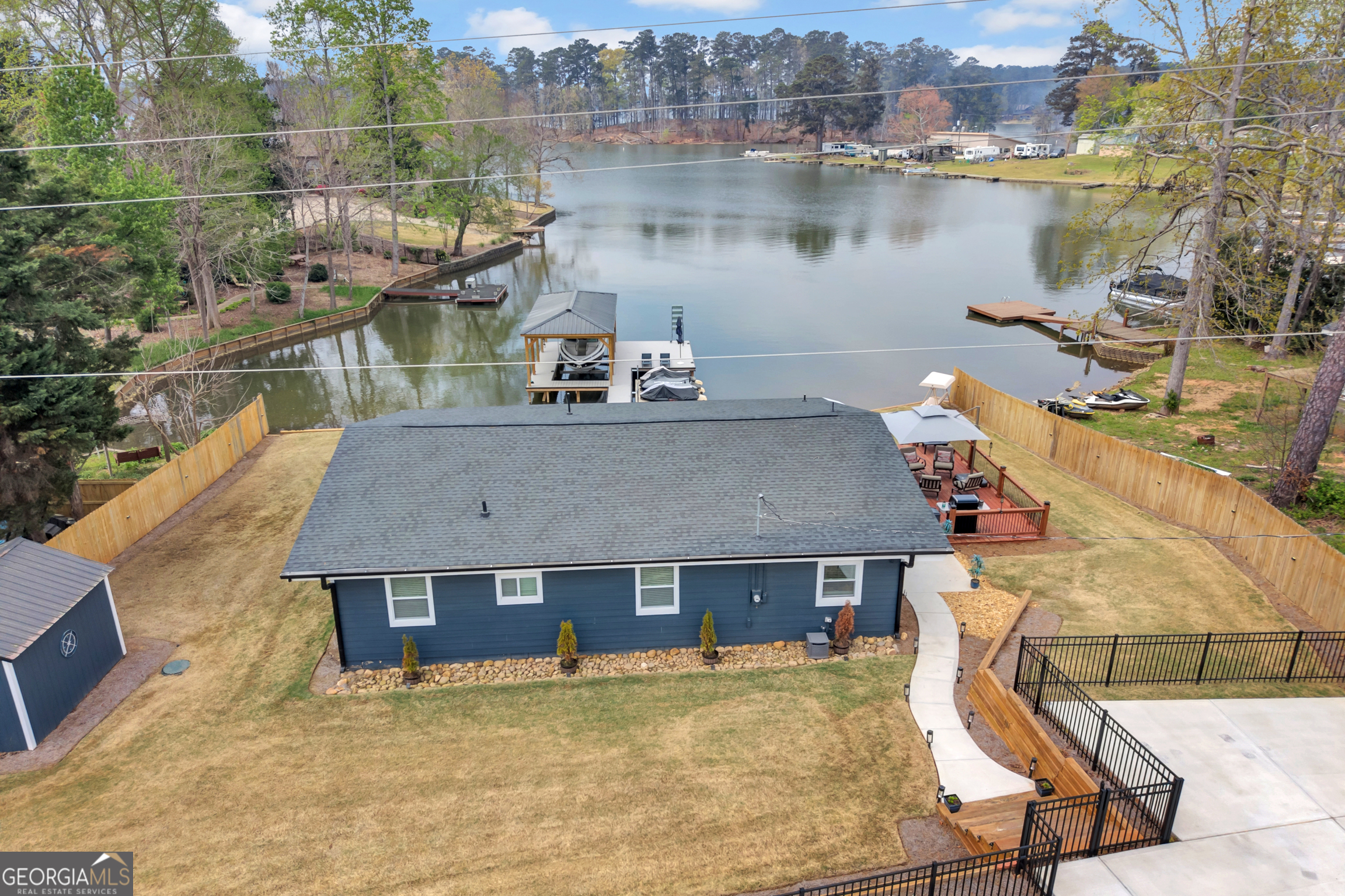 8900 Jackson Lake Road Monticello, GA 31064 - Photo 8 of 72 an aerial view of a house with a lake view
