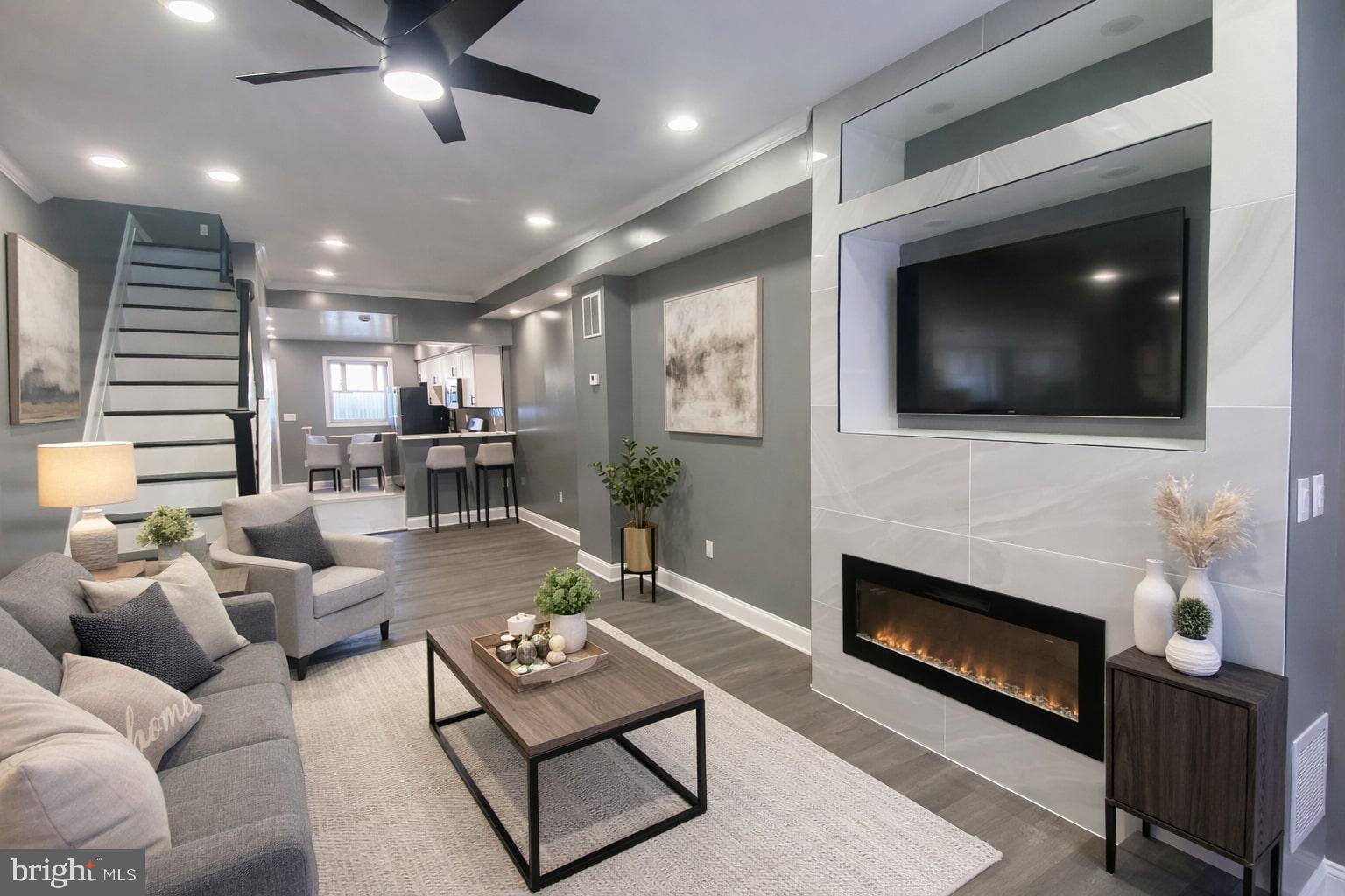 a living room with furniture and a fireplace