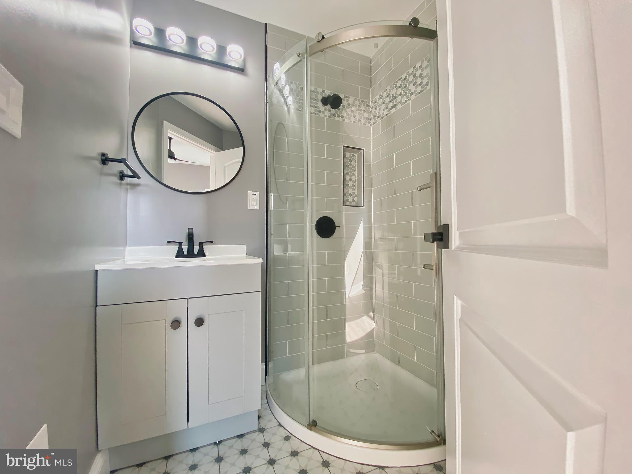 1604 Cliftview Avenue Baltimore, MD 21213 - Photo 15 of 36 a bathroom with a sink a toilet and a mirror