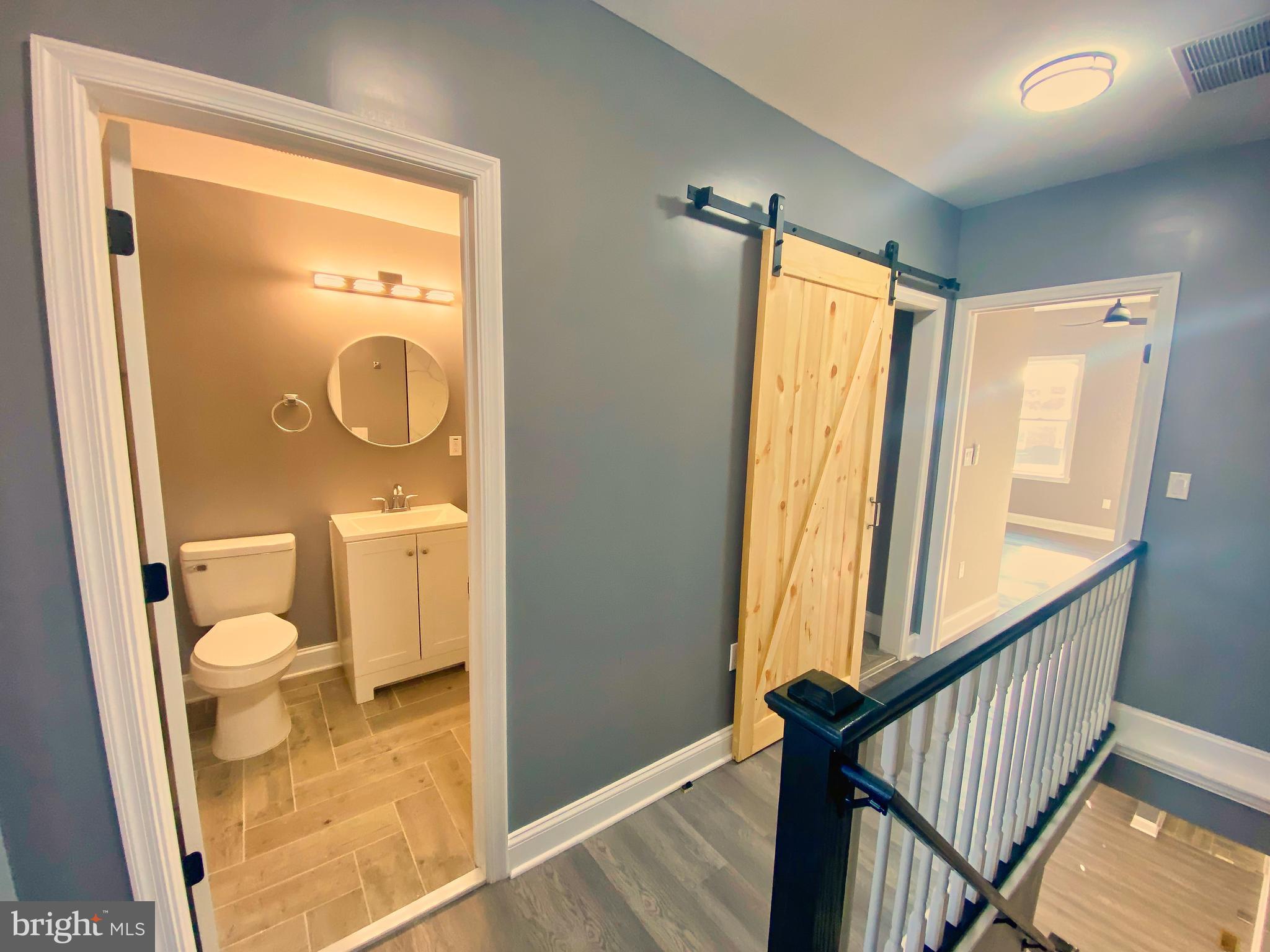 1604 Cliftview Avenue Baltimore, MD 21213 - Photo 26 of 36 a bathroom with a toilet and a shower