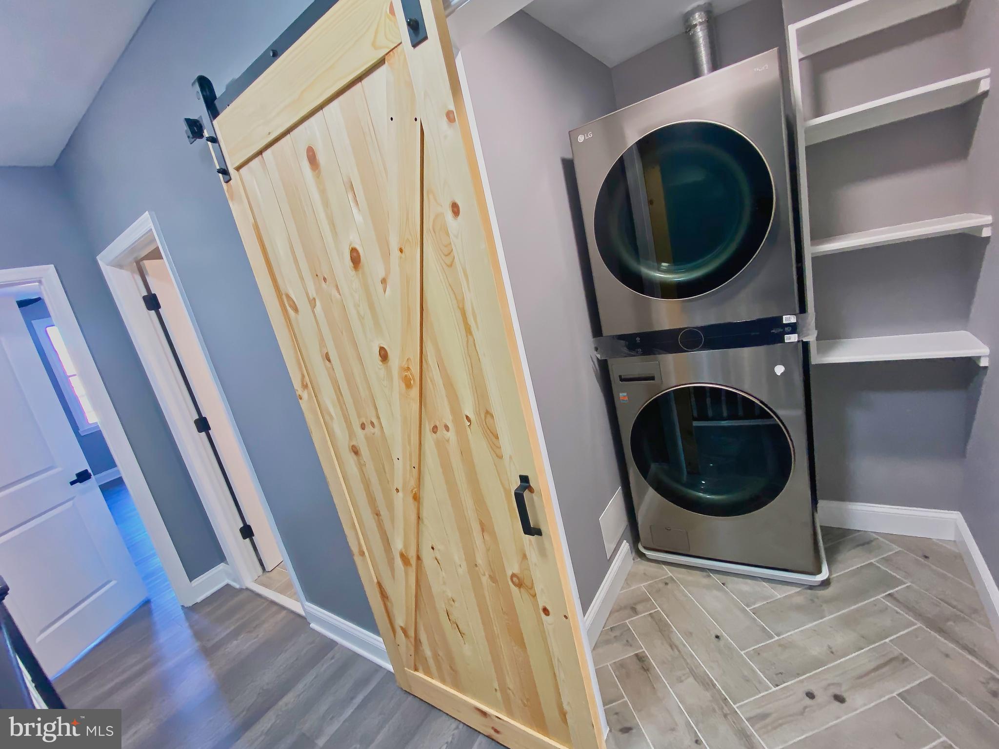 1604 Cliftview Avenue Baltimore, MD 21213 - Photo 29 of 36 a view of a hallway with washer and dryer