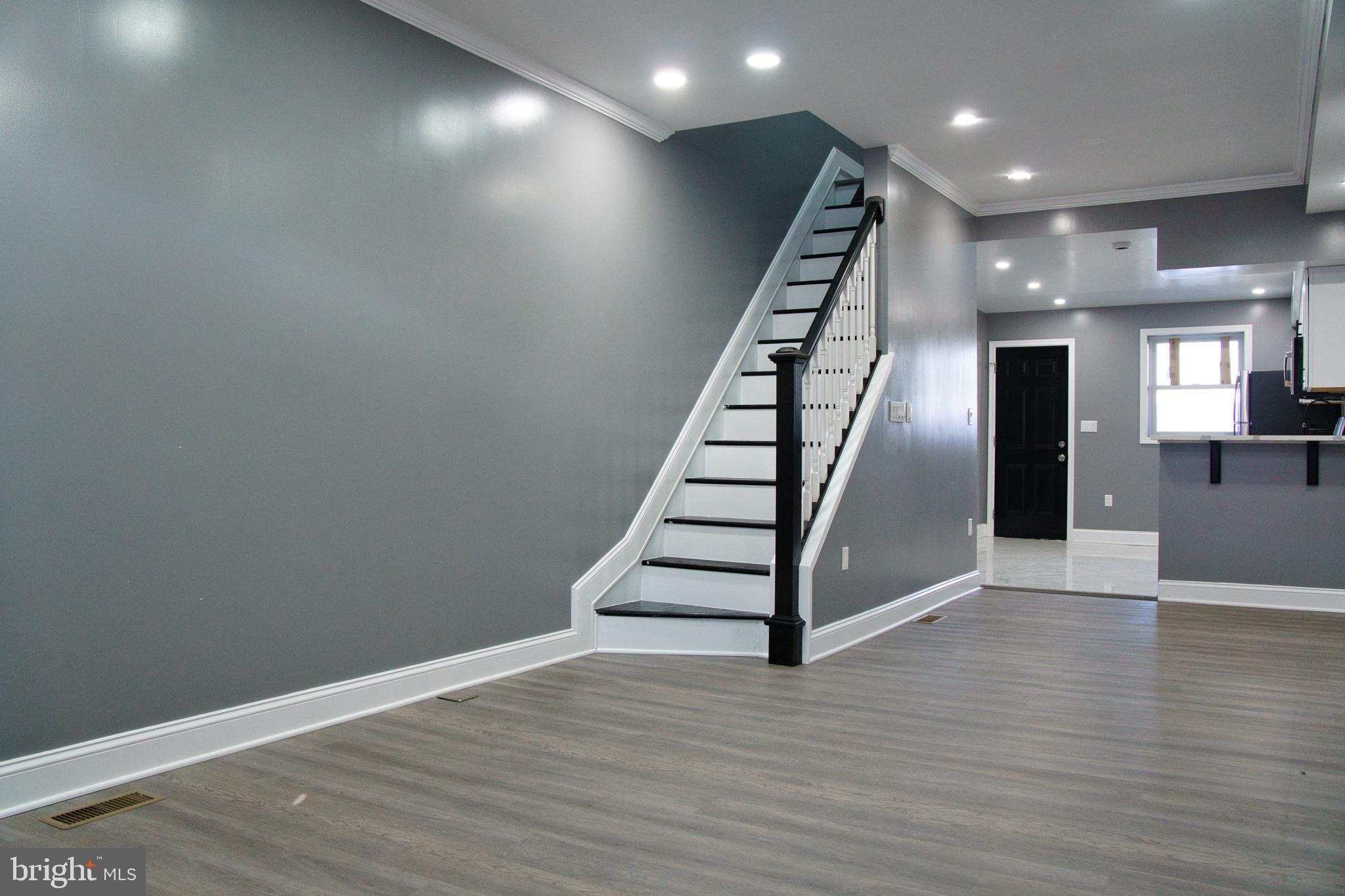 1604 Cliftview Avenue Baltimore, MD 21213 - Photo 36 of 36 an empty room with wooden floor and entryway