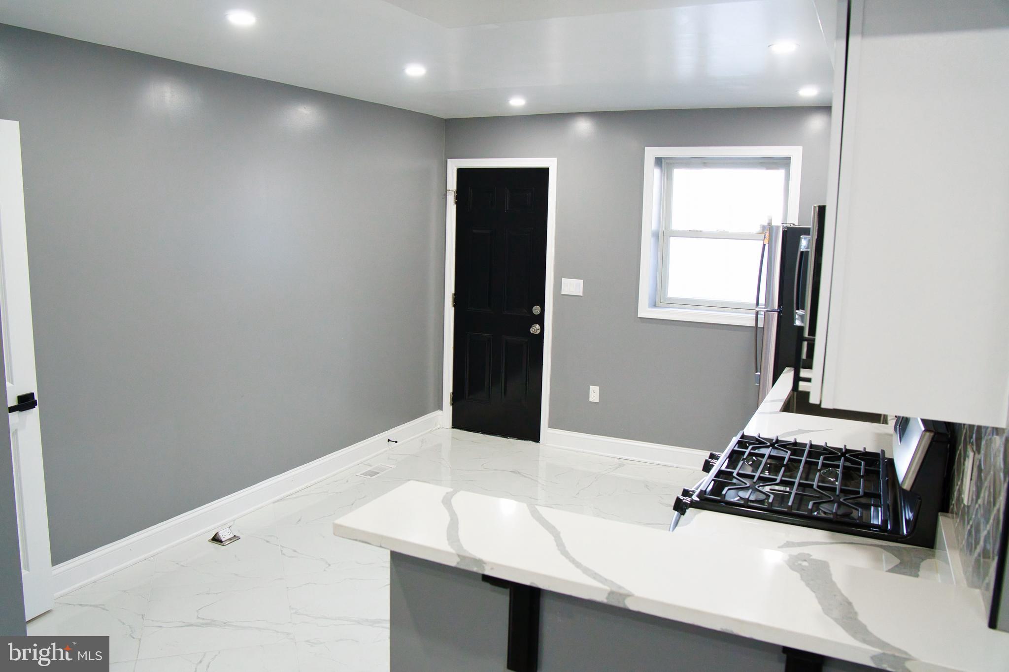 1604 Cliftview Avenue Baltimore, MD 21213 - Photo 5 of 36 a bathroom with a sink and a mirror
