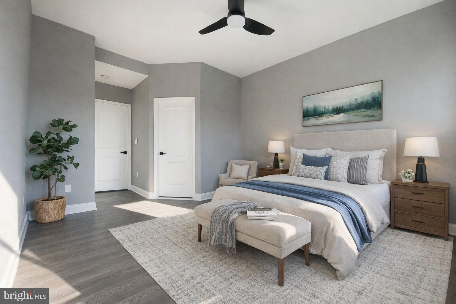 1604 Cliftview Avenue Baltimore, MD 21213 - Photo 8 of 36 a bedroom with a bed and potted plant