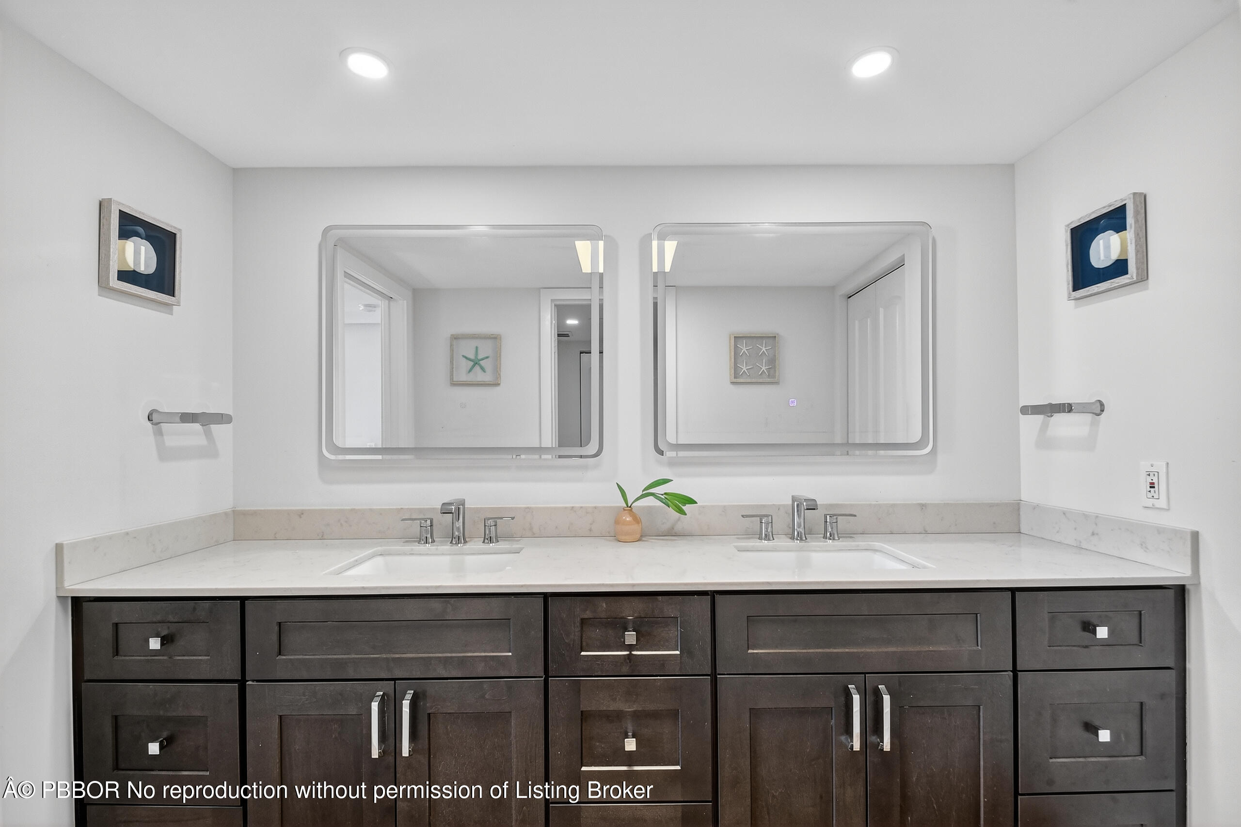 3610 South Ocean Boulevard, Unit 608 Palm Beach, FL 33480 - Photo 12 of 38 a bathroom with a sink double vanity and a mirror