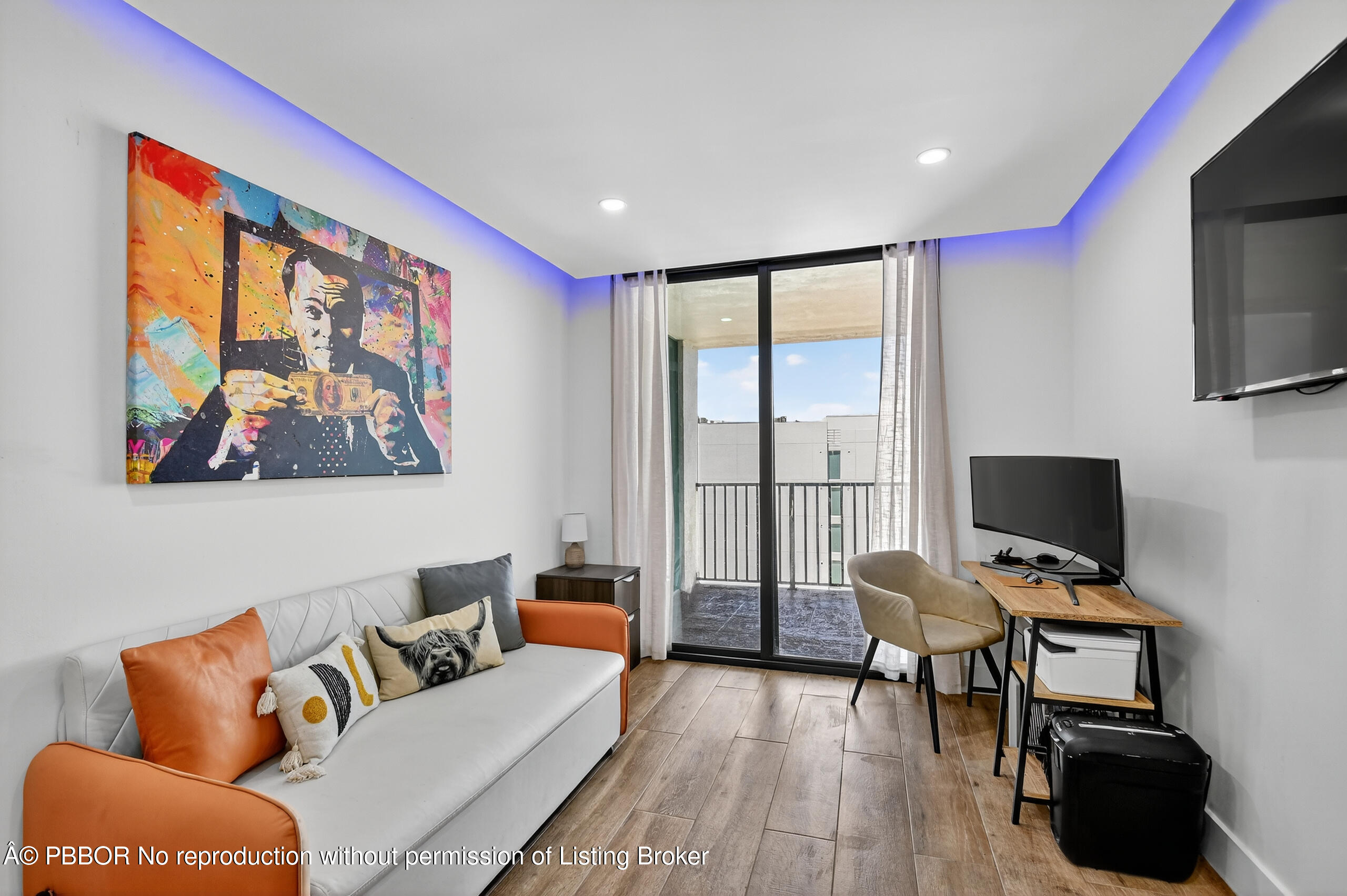 3610 South Ocean Boulevard, Unit 608 Palm Beach, FL 33480 - Photo 14 of 38 a living room with furniture and a flat screen tv