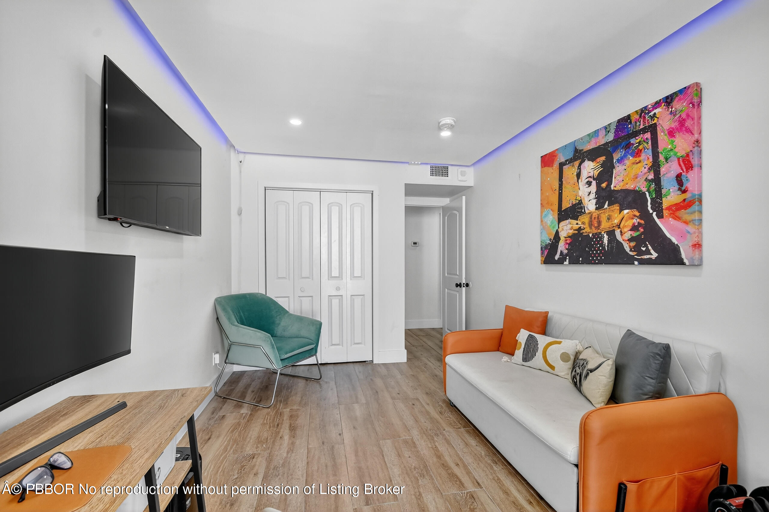 3610 South Ocean Boulevard, Unit 608 Palm Beach, FL 33480 - Photo 15 of 38 a living room with furniture and a flat screen tv