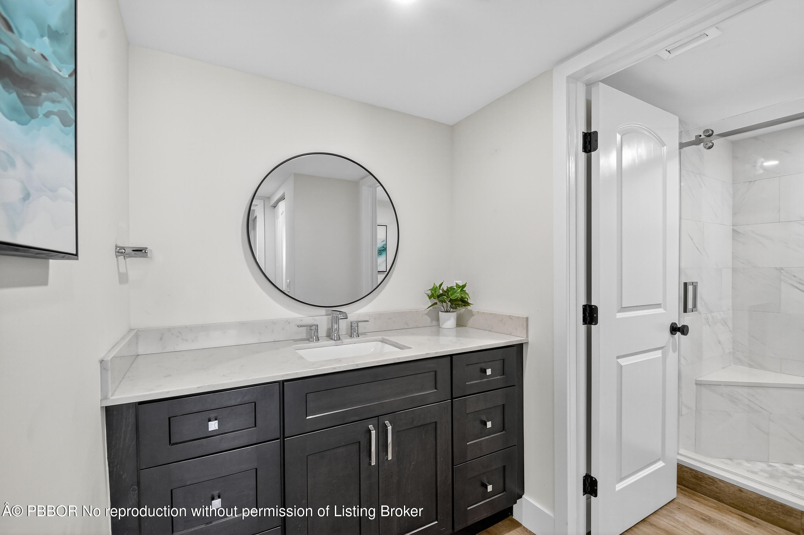 3610 South Ocean Boulevard, Unit 608 Palm Beach, FL 33480 - Photo 16 of 38 a bathroom with a sink and a mirror