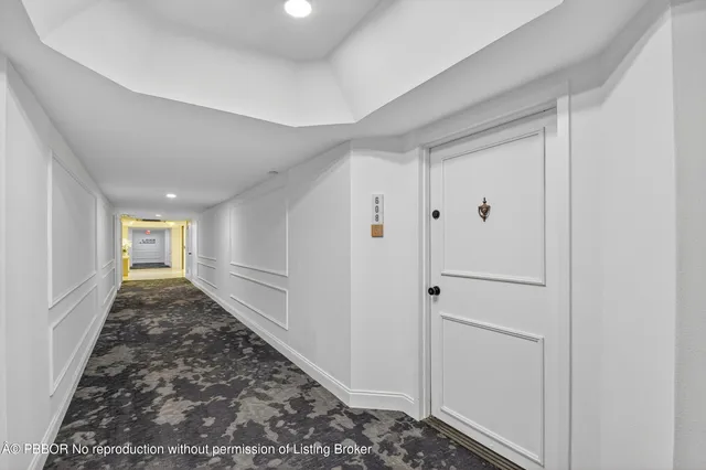 a view of a hallway with front door