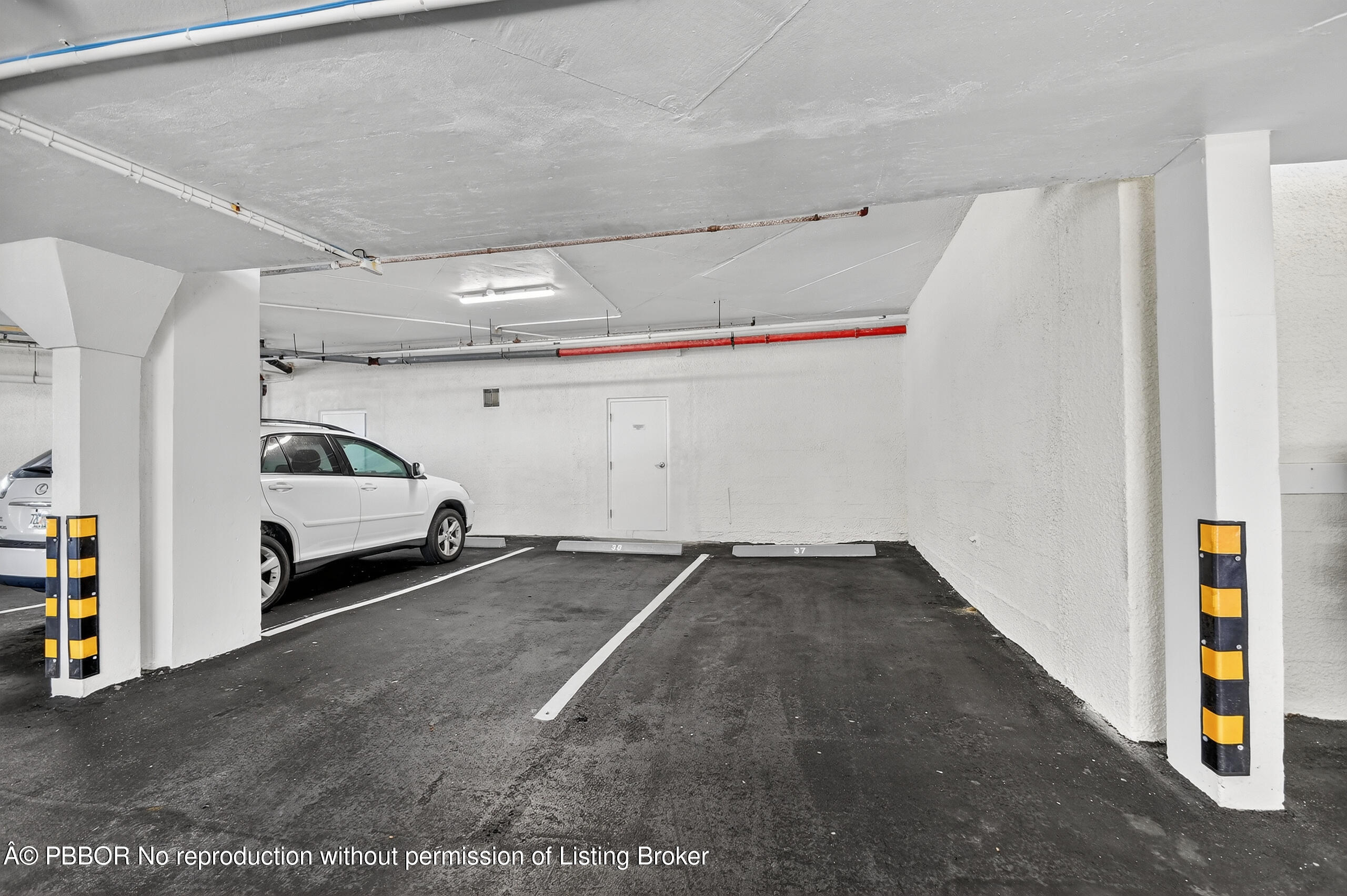 3610 South Ocean Boulevard, Unit 608 Palm Beach, FL 33480 - Photo 25 of 38 a car parked in parking area